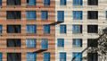 Жилой комплекс «Черняховского 19». Фасад имеет уникальную палитру и рисунок окон.  Фото от 17.09.2018 г.